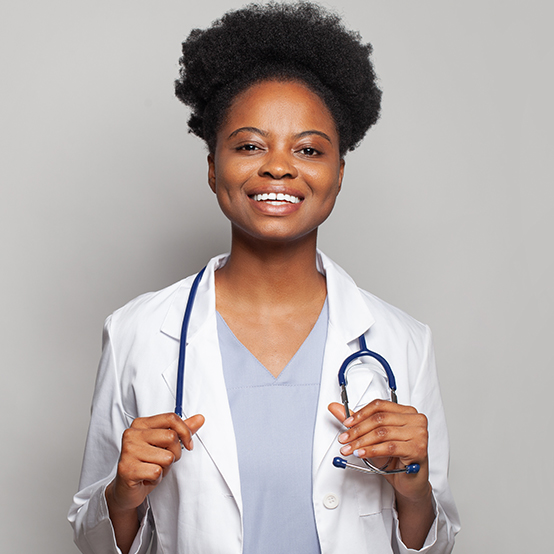 African nurse holding stethoscope over shoulders